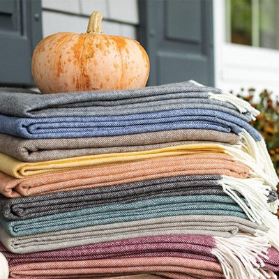 Snuggle up -- cozy blankets to layer on the bed, couch and even yourself!